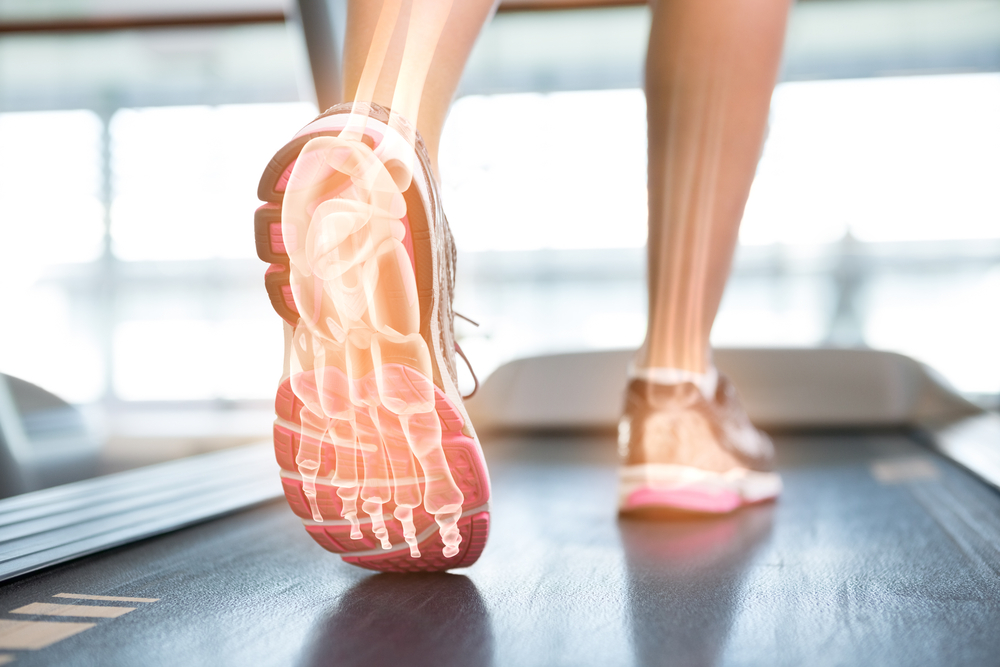 Digital composite of Highlighted foot of woman on treadmill